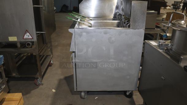 Frymaster 22EF SP double electric deep fryer, 208/240V, stainless steel, used condition, with caster wheels.