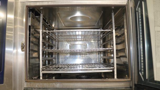 Rational iCombi Pro LM100EE stainless steel commercial convection oven interior, visible shelves, excellent condition.