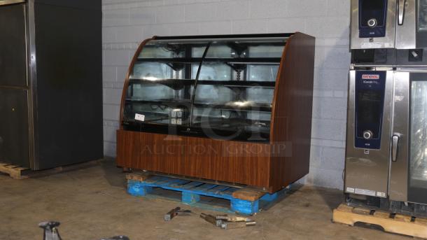 Structural Concepts H5C5650LR display case, refrigerated/non-refrigerating, curved glass, self-contained, 120v, wood finish.