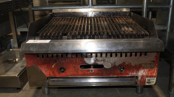 Avantco 2 burner gas grill with stainless steel finish, showing wear and discoloration. Features manual controls and label with model info.