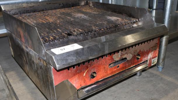 Avantco 2 burner gas grill, used condition with noticeable wear. Features metal frame, grilling surface. Marked settings.