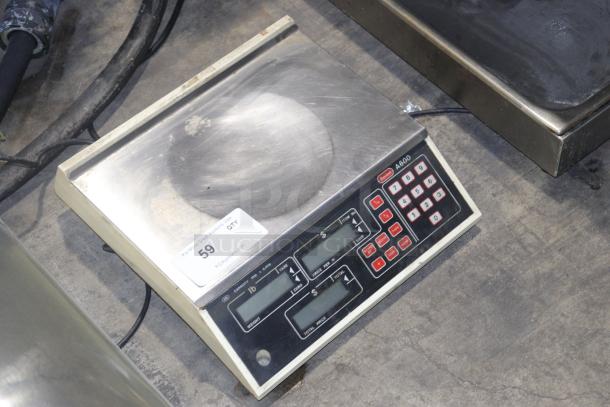 Berkel A600 Scale for deli/produce, digital display, keypad, used condition, visible label with auction info.