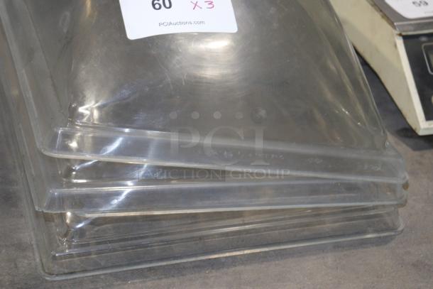 Clear plastic Royal product case cover, gently used condition. Stack of three; auction label visible, marked "60 X3".