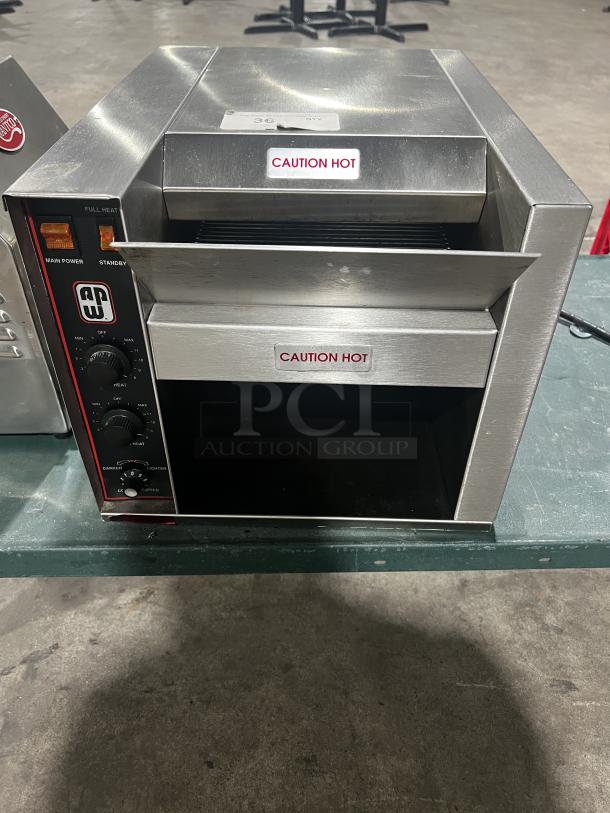Wyott AT-10 Conveyor Toaster, excellent used condition, 208/240V, tested working. "CAUTION HOT" labels displayed.