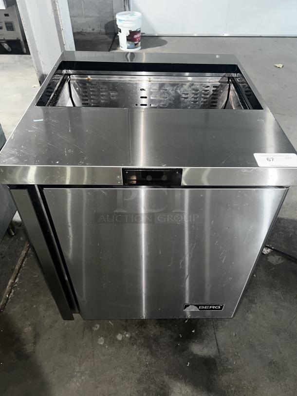 Stainless steel BERG BERS27 sandwich prep table with 8-pan capacity and 1-door. Good condition, visible scuffs. BERG logo on front.