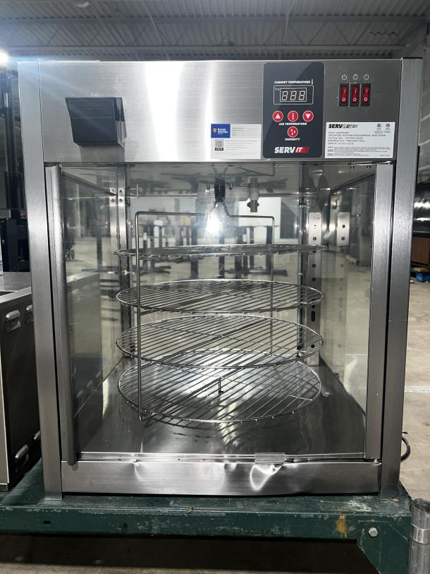 SERVIT 423PDW18D1 18" full-service pizza warmer with digital controls, three shelves, stainless steel frame, excellent condition.