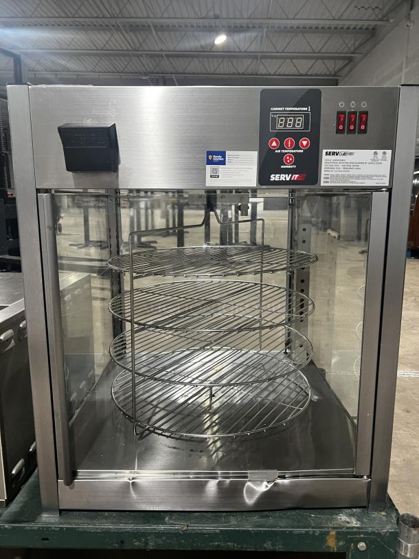 SERVIT 423PDW18D1 18-inch full-service pizza warmer, stainless steel, with digital controls, four wire racks, excellent condition.