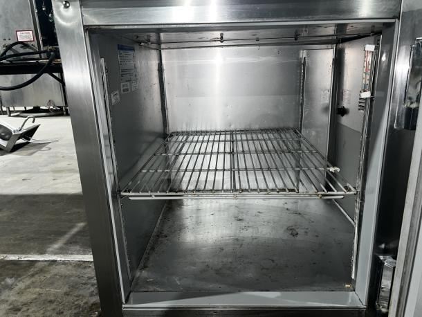 Beverage-Air DP46HC pizza prep table, stainless steel, spacious interior with wire shelf, suited for commercial kitchens.