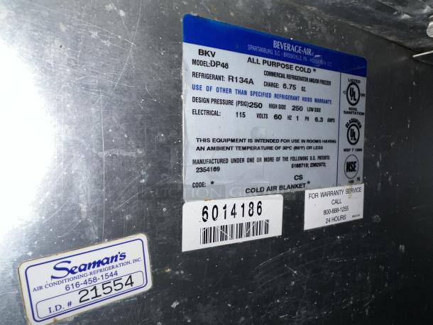 Beverage-Air pizza prep table model DP46HC, stainless steel, durable for commercial use. Labels indicate specs and warranty details.