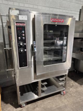 Almost new Market Forge MFC-101 S/AA electric combi commercial steamer; stainless steel, visible control panel, interior racks.