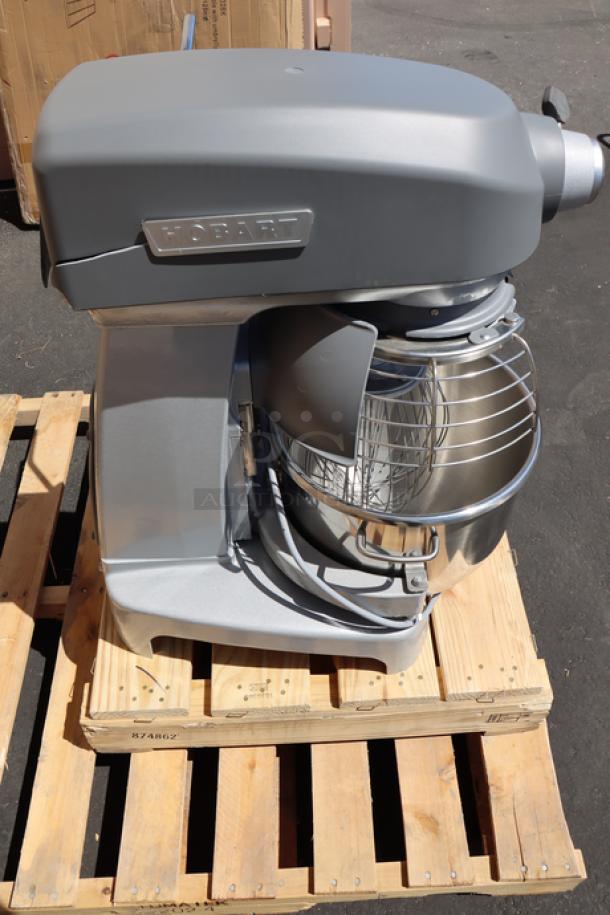 Hobart Legacy+ HL200 20 Qt. mixer with bowl, guard, beater, whip, dough hook. Brand new; minor crack on plastic cover.