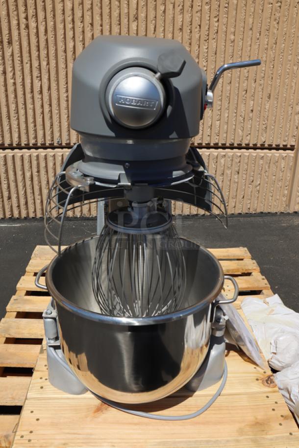 Hobart Legacy+ HL200 20 Qt. mixer, stainless steel bowl, guard, beater, whip, dough hook. Plastic cover cracked. Model HL200-1STD.
