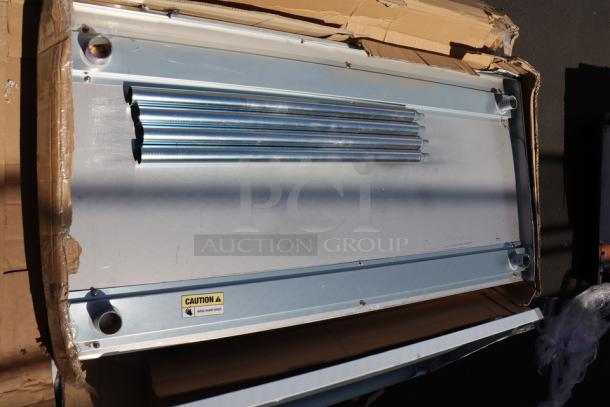 Regency 30" x 60" stainless steel work table, model 600TB3060G, with 4" backsplash. Minor scratching and denting.