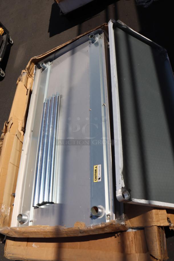 Brand new Regency 30"x60" stainless steel work table, model 600TB3060G, with 4" backsplash, damaged packaging.