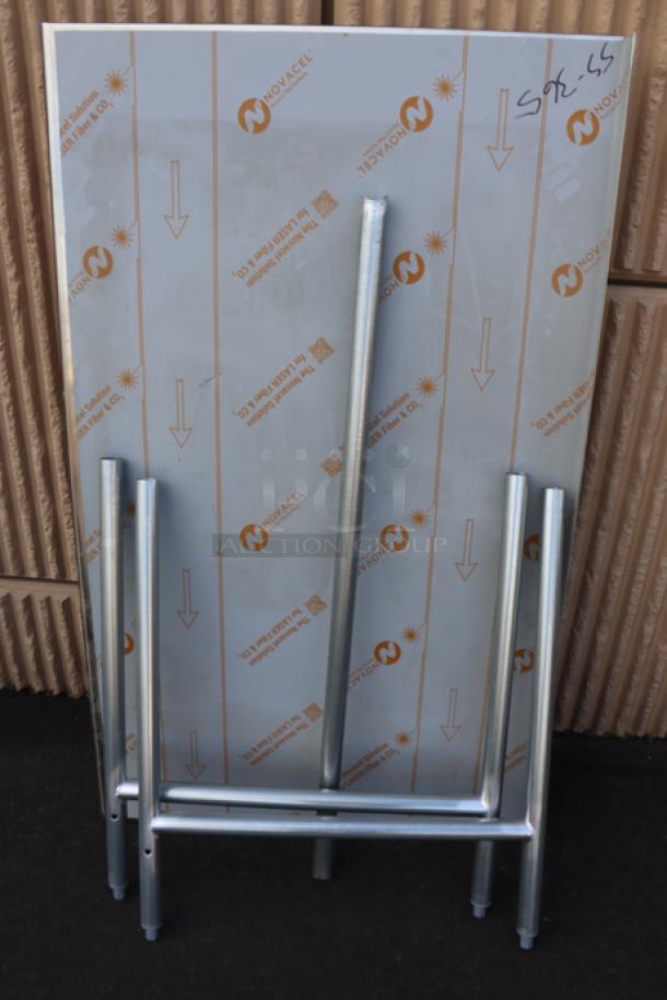 Brand new Advance Tabco TFLG-365 36" x 60" stainless steel work table, 14-gauge, open base, with 1.5" backsplash.