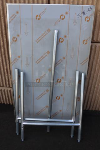 Brand new Advance Tabco TFLG-365 36" x 60" stainless steel work table, 14-gauge, open base, with 1.5" backsplash.
