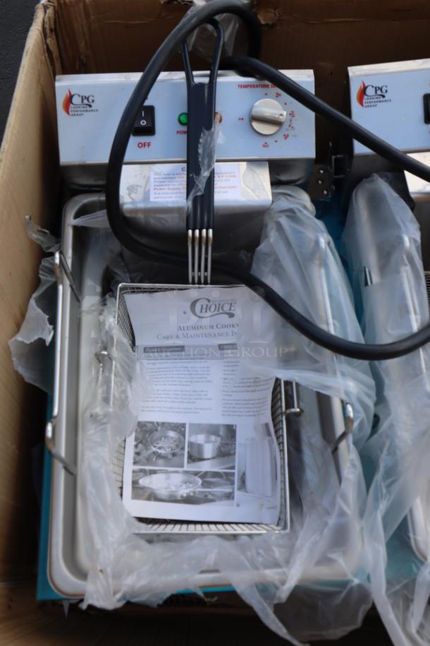 Brand new Cooking Performance Group EF302 dual tank electric fryer in original packaging. Features visible controls and protective wrap.