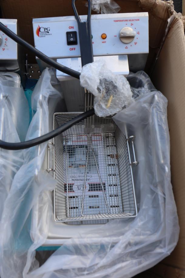 Brand new Cooking Performance Group EF302 electric countertop fryer, dual tank, 30 lb capacity, in original packaging.