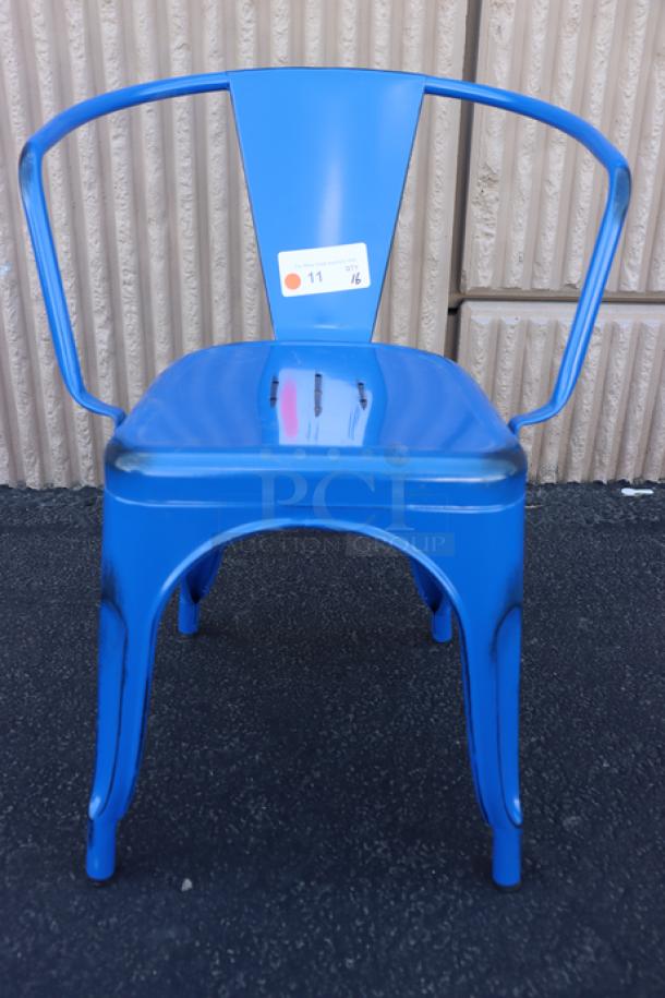 Brand new Lancaster Table & Seating Alloy Sapphire Outdoor Arm Chair, model 164CMARMNVY, blue, metal construction, auction tag visible.