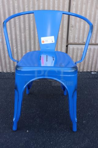 Brand new Lancaster Table & Seating Alloy Sapphire Outdoor Arm Chair, model 164CMARMNVY, blue, metal construction, auction tag visible.