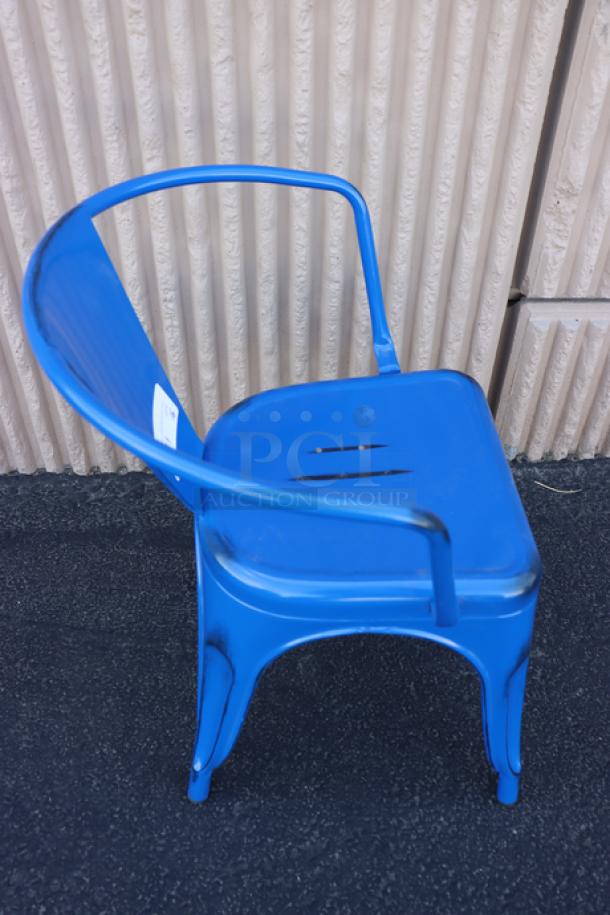 Brand new Lancaster Table & Seating Sapphire Outdoor Arm Chair, model 164CMARMNVY, featuring a vibrant blue finish.