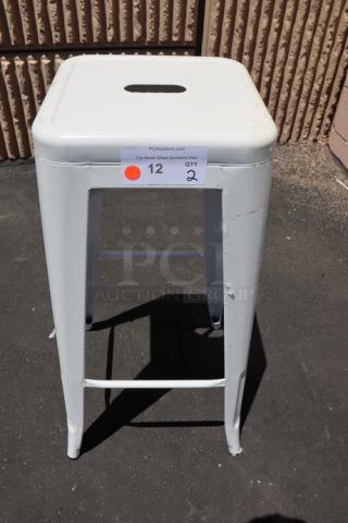 Brand new Lancaster Table & Seating 164BMBKLSWHT backless barstool, pearl white, outdoor use, minor scratching visible.