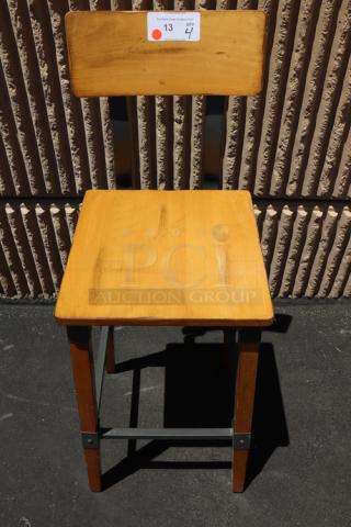 Brand new Lancaster Table & Seating 164BINDNATAN industrial bar stool with honey maple finish, visible label, out of packaging.