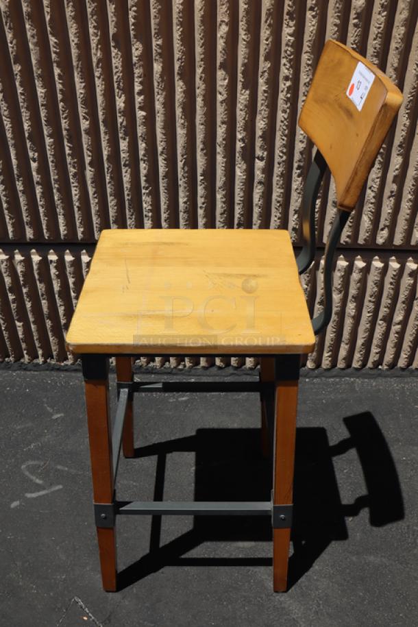 Brand new Lancaster Table & Seating 164BINDNATAN industrial bar stool with honey maple finish, out of packaging.