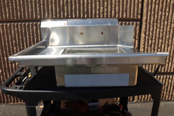 Brand new Regency 600DDT36L 3' soiled dish table with left drainboard, 16 gauge stainless steel. Slight scratch-n-dent condition.