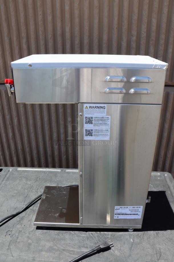 Brand new Curtis D500GT12A000 automatic airpot coffee brewer, stainless steel, digital controls, 120V, 1,675W, visible labels.