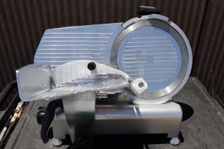 Avantco SL312 12" Manual Meat Slicer, 1/3 hp, 120V. Out of original packaging, with scuffs and scratches. Serial: 03 017525 SL312.