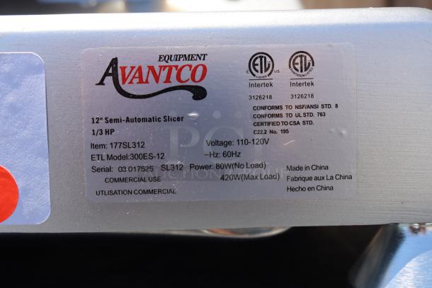 Avantco SL312 12" meat slicer label showing model, serial number 03 017525, 1/3 hp, 120V specs, scuffs visible.