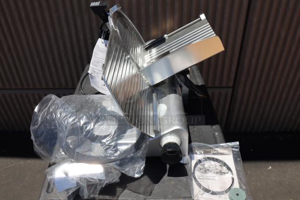 Brand new Avantco SL312 12" meat slicer. Manual, 1/3 hp, 120V, 420W. Out of packaging, with scuffs. Includes manual.