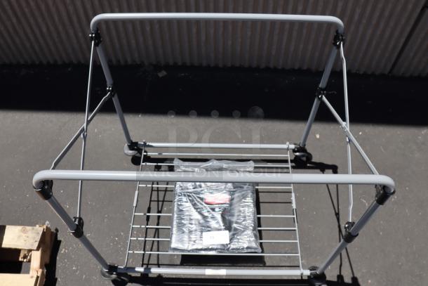 Brand new Rubbermaid® 1881750 collapsible X-Cart, 8 bushel capacity, without original packaging, durable metal frame.