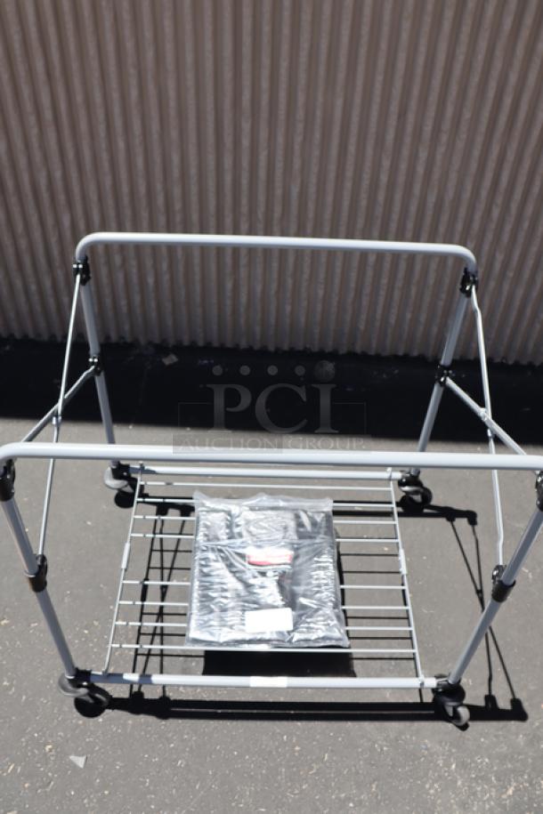 Brand new Rubbermaid® 1881750 collapsible 8 bushel laundry cart, gray frame, packaged parts visible, no original packaging.