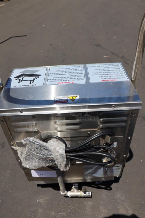 Fryclone 259OFM55 55 lb. Portable Fryer Oil Filter Machine with 2-Way Pump. Visible cord, warning labels. Slight oil residue.