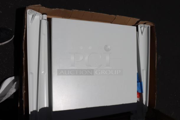 Brand new Lancaster Table & Seating 24" x 24" outdoor table, model 164RD242YEL. Box damaged, possible minor scratches/dents.