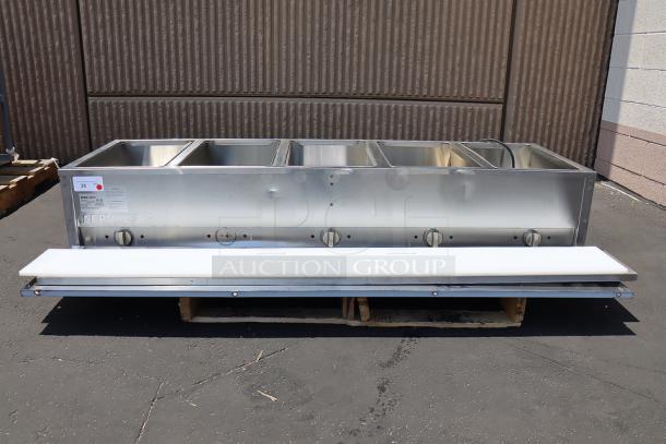 Brand new ServIt model 423EST5WOPB five pan electric steam table with superficial dents, partially enclosed base, 3750W.