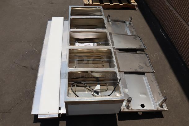 BRAND NEW ServIt 423EST5WOPB five pan steam table with superficial dents, partially enclosed base, 208/240V, 3750W.