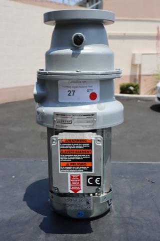 BRAND NEW Hobart FD4/125-1 Commercial Garbage Disposer with short upper housing, 1 1/4 hp, 208-240/480V, superficial scratches. Serial: 104010862-TBA. Warning labels visible.