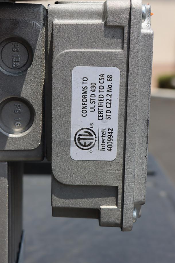 Hobart FD4/125-1 garbage disposer with certification label, showing superficial scratches.