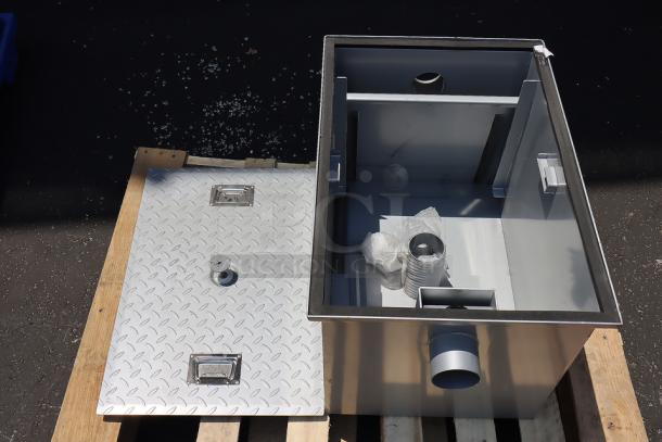 Regency 600GT25 50 lb. grease trap, 25 GPM, silver, non-threaded connections, superficial scuffs, includes components.