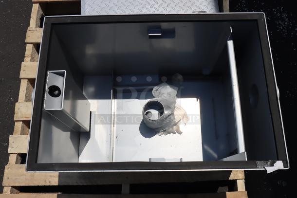 Regency 600GT25 50 lb. grease trap with 25 GPM capacity, 3" non-threaded connections, new with minor scuffs.