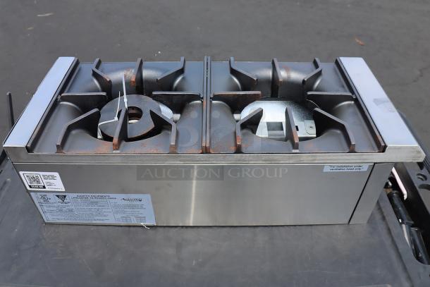 Avantco CAG-R-2-12 12" 2 burner gas range, 50,000 BTU, scratches, dents, serial 1168660000011, tags visible, out of packaging.