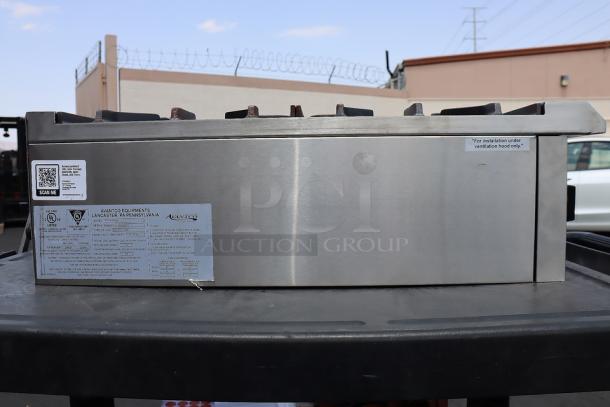 Avantco Chef Series CAG-R-2-12 gas countertop range, 12", 2 burners, 50,000 BTU. Scratches, dents visible. Serial: 1168660000011.