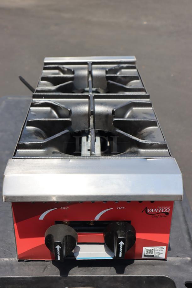 Avantco Chef Series CAG-R-2-12 gas range, 12" 2 burners, 50,000 BTU. Missing burners, with scratches and dents, adjustable legs.