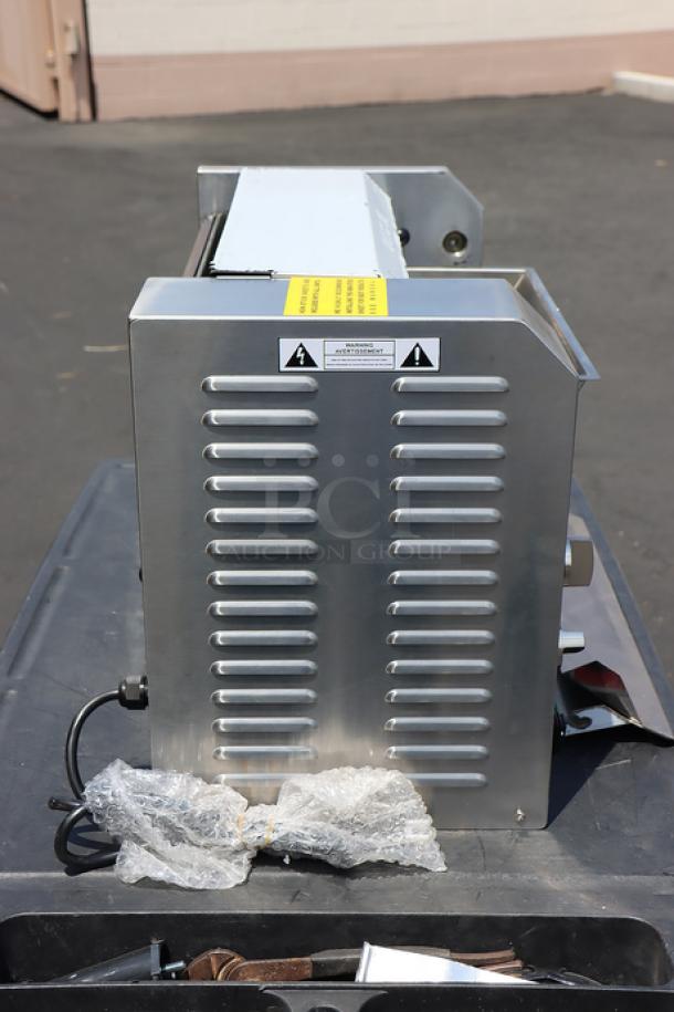 Brand new Avantco BT18A vertical contact conveyor bun toaster, 120V, 1600W. Minor scratches, serial no. 2302124184BT18A.
