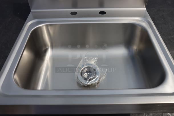 Regency 600HS172HDM 17" stainless steel wall-mounted hand sink, includes drain basket, minor scuffing.