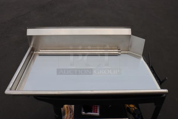 Regency 600CDT48L 4' Clean Dish Table with left drainboard, stainless steel, minor denting, bent backsplash corner.
