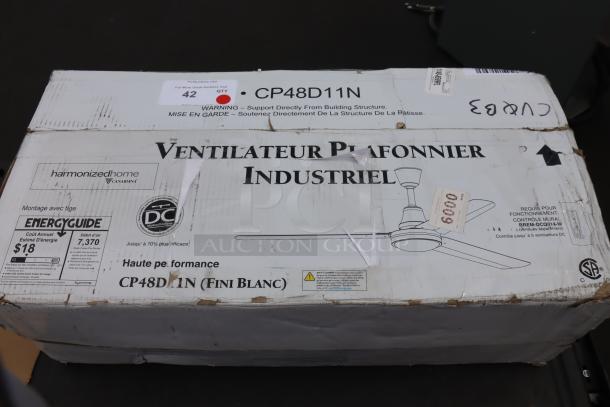 Canarm CP48D11N 48" white industrial ceiling fan in box, 7370 CFM, 120V, new scratch-n-dent condition, EnergyGuide tag visible.